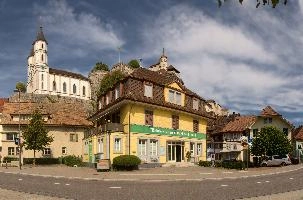 Aarburg seen from street level, showing the castle and Evangelical church behind a plasterer, zofingen, church, townscape, europe, switzerland, aargau, evangelical, aarburg, solothurn, towers, castle, landscape