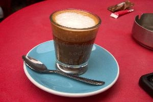 Coffe in Annecy, France, Annecy, europe, france, haute-savoie, café, coffee, bill, payment, euros, coins, table, red, foam, glass, saucer