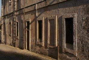Doors and windows of building in Arona in oblique light, wall, door, shadow, sunlight, facade, exterior, arona, piemonte, perspective, italy, windows, europe, building