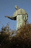 Colossus of Saint Charles Borromeo, a monumental statue at Arona in Piemonte, bronze, carol, colossus, charles, outdoors, figure, sunlight, religious, maggiore, catholic, lake, tourist attraction, arona, icon, piemonte, sculpture, italy, saint, europe, statue, borromeo
