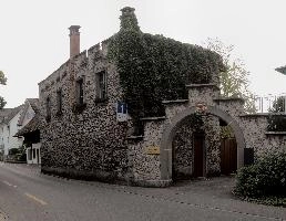 Arched entrance to courtyard of old, stone building in Swiss town of Baar, caves, traditional, building, street, exterior, courtyard, outdoors, rock, summer, crenelleted, höllgrotten, stone, baar, archway, switzerland, walls, europe, rural