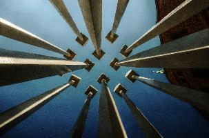 Converging lines of artwork seen against the sky; 2018 quadrennial of Bad Ragartz art festival in Switzerland, artwork, abstract, art, lines, ragartz, converging, ragaz, skyward, bad, perspective, grisons, vanishing point, graubünden, towers, sky, posts, swiss, poles, switzerland, sculpture, wooden,  2018 quadrennial of bad ragartz art festival in switzerland