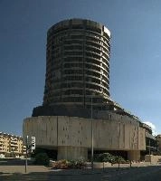 BIS Building of Basel, tower, urban, swiss, international, grey, bank, basel, europe, bis, sky, ugly, city, sunshine, blue, switzerland, settlements, cylinder, round, banking, architecture