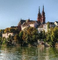Basel cathedral, seen across the Rhein in Autumn, rhein, blue sky, stone, autumn, sandstone, spires, red, towers, minster, historic, cathedral, cahtolic, basel, christian, switzerland, religion, swiss, bank, europe, river, sunshine