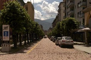 Open-air cafe and buildings in station area, Bellinzona in Grisons, street, italian, europe, switzerland, grisons, sunlight, bellinzona, summer, station, town, buildings, avenue, café, paved, open-air, diners