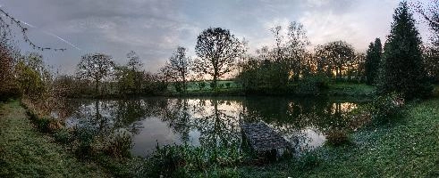 Calm waters of a small lake in the Breton countryside, France, water, lake, french, rural, countryside, la chapelle-neuve, still, restougouin, peaceful, callac, garden, brittany, reflections, france, calm