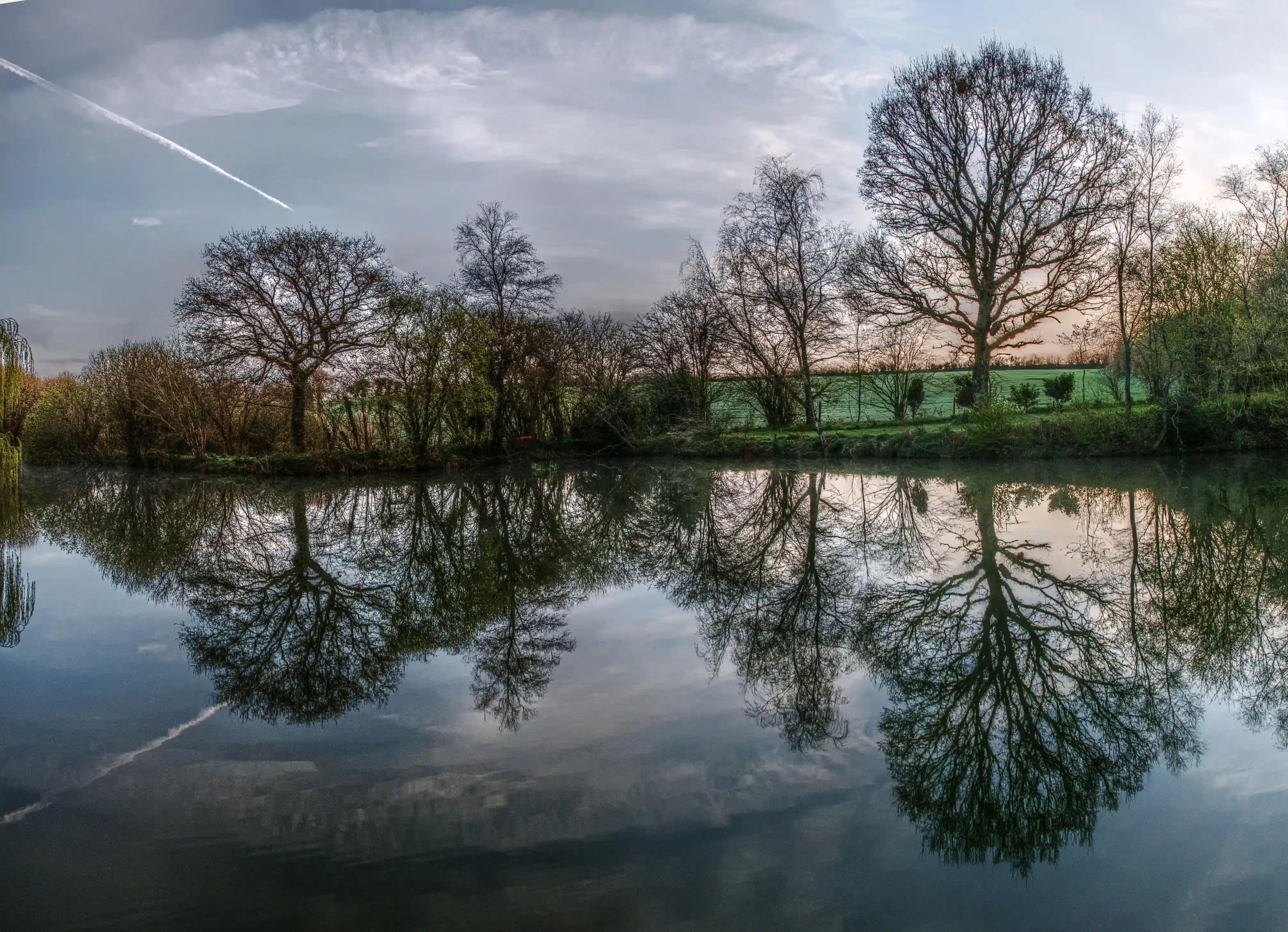 Calm waters of a small lake in the Breton countryside, France, water, lake, french, rural, countryside, la chapelle-neuve, still, restougouin, peaceful, callac, garden, brittany, reflections, france, calm
