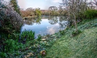 Calm waters of a small lake in the Breton countryside, France, water, lake, french, rural, countryside, la chapelle-neuve, still, restougouin, peaceful, callac, garden, brittany, reflections, france, calm