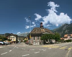 Blue tit (Parus caeruleus) on nut dispenser, Switzerland, church, town, mountains, swiss, summer, alley, flums, rural, switzerland, sunny, village, stone, building, picturesque, daylight, alpine, alps, sky, blue, travel, historic