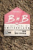 Bed-and-breakfast sign in Graubünden, switzerland, europe