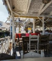 Bar scene in Chania, Crete, restaurant, summer, bar, airy, island, open, europe, interior, autumn, white, tourism, wooden, outdoor, chairs, mediterranean, seating, crete, terrace, greece, catering, holiday