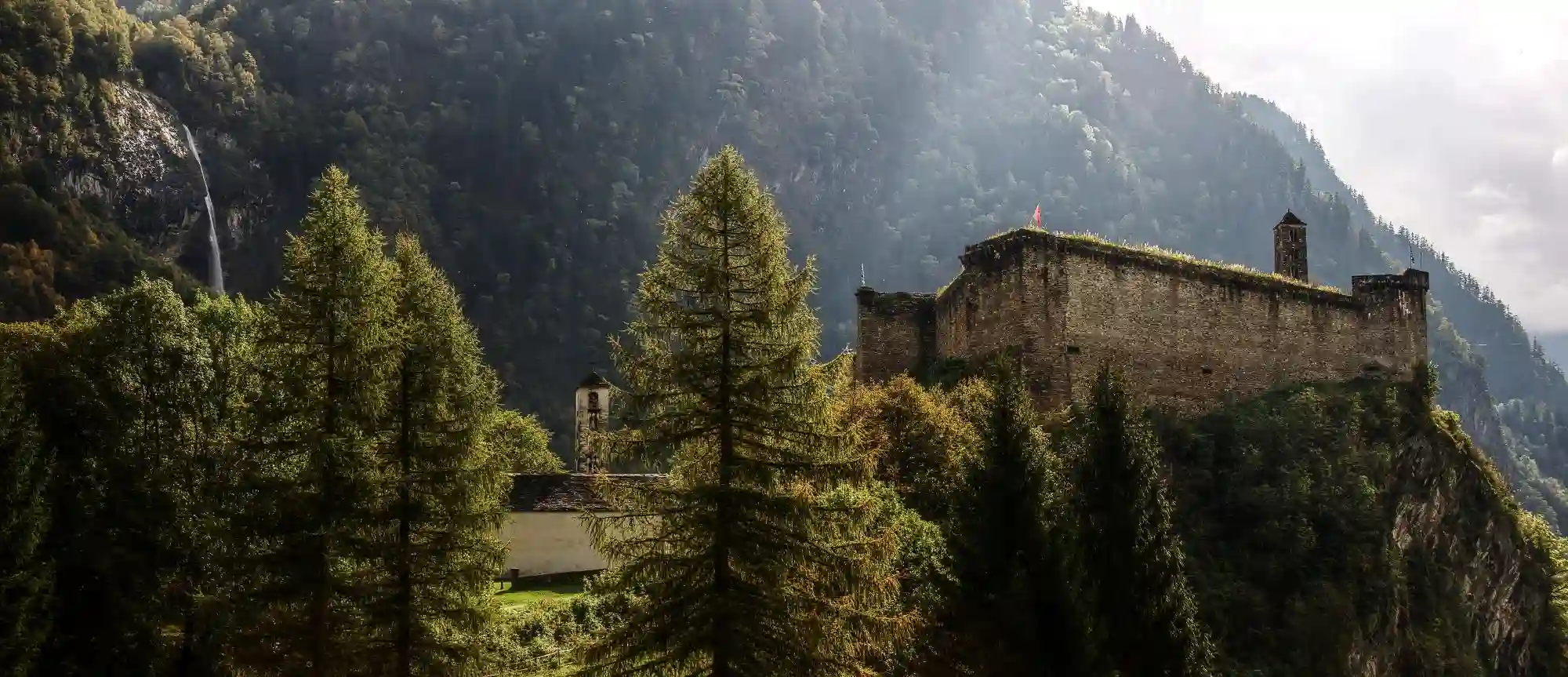The Castello di Mesocco in the Grisons, Swiss Alps, scenery, summer, historic, view, beautiful, edifice, castle, dramatic, stone, castello, clouds, south, mesocco, haze, route, grisons, rays, church, old, graubünden, sunlight, village, ruin, europe, valley, mist, alpine, swiss, italian, light, mountains, switzerland, scenic, evening, alps