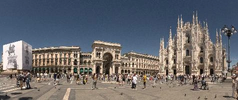 Milan cathedral from the square seen in bright sunglight, catholicism, religion, sunshine, summer, church, cathedral, white, duomo, stone, italy, architecture, milan, monumental, europe, historic