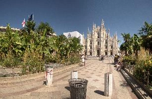 Milan cathedral from the square seen in bright sunglight, italy, catholicism, sunshine, church, white, cathedral, milan, historic, europe, palms, duomo, monumental, religion, summer, stone, architecture