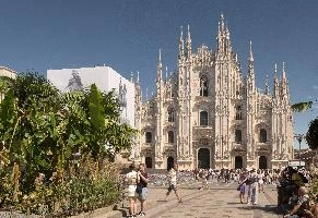 Milan cathedral from the square seen in bright sunglight, italy, catholicism, sunshine, church, white, cathedral, milan, historic, europe, palms, duomo, monumental, religion, summer, stone, architecture