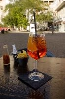 Aperol Spritz in Milano, glass, bitters, prosecco, orange, spritz, aperol, cocktail, italy, table, milan, straw, europe, drink