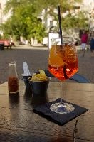 Aperol Spritz in Milano, glass, bitters, prosecco, orange, spritz, aperol, cocktail, italy, table, milan, straw, europe, drink