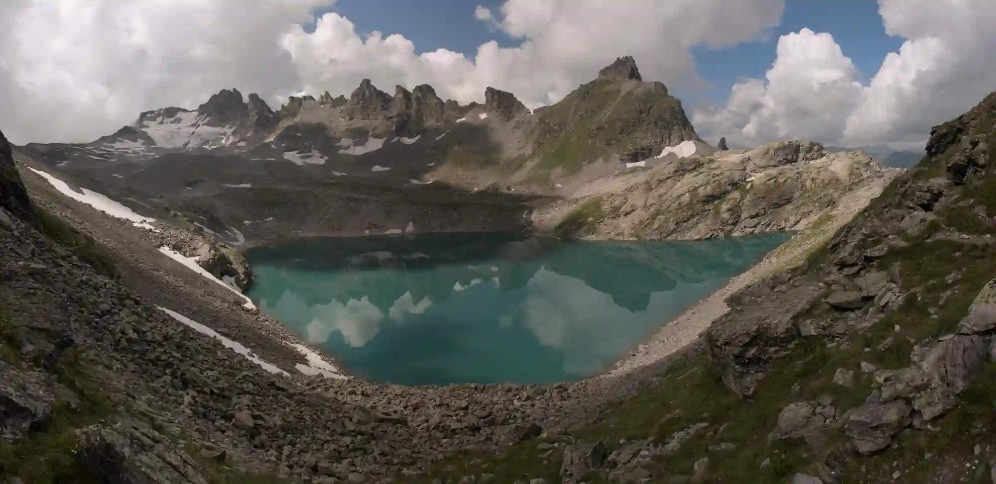Teal waters of the Wildsee on the Pizol 5-lakes walk, turquoise, wildsee, wild, lake, glacial, pizol, water, sargans, hiking, mountains, walking, alps, outdoors, switzerland, summer, europe, teal
