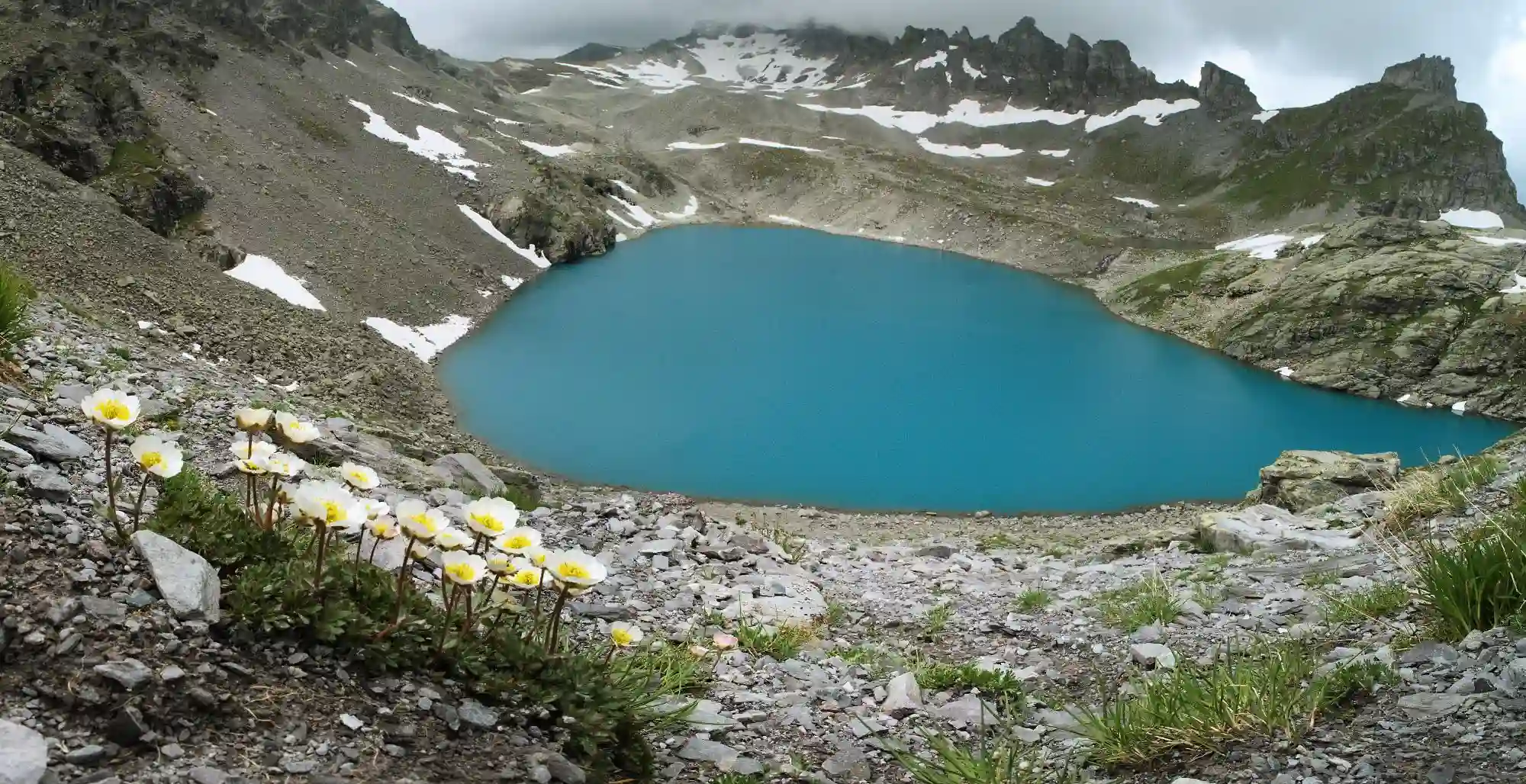 Teal waters of the Wildsee on the Pizol, Switzerland, swiss, pizol, native, sankt, alpine, walk, mountains, white, switzerland, view, mels, flora, europe, hike, flower, alps, ranunculus, wangs, wildsee, turquoise, teal, yellow, gallen, spring, five lakes, 5-lakes, lake, aquamarine