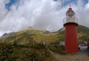 Landlocked Lighthouse on the road to the Furkapass, lighthouse, grisons, tomasee, andermatt, sky, moody, stormy, landcocked, cloud, isolated, europe, red, switzerland, tower