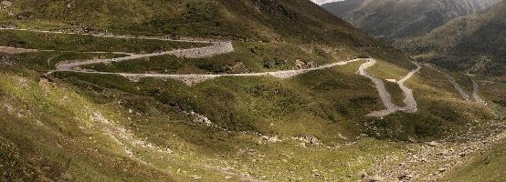 Serpentine road leading up to the Furka Pass in Grisons, Switzerland, bends, serpentine, route, road, furkapass, tomasee, andermatt, summer, grisons, green, switzerland, hillside, europe, winding