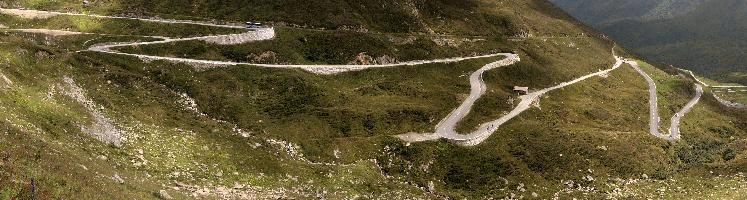 Serpentine road leading up to the Furka Pass in Grisons, Switzerland, bends, serpentine, route, road, furkapass, tomasee, andermatt, summer, grisons, green, switzerland, hillside, europe, winding