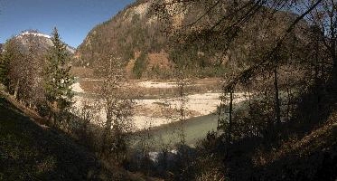 Stretch of the Grisonian Alpine Rhine river at Rhäzuns, showing shingle bed, water, bed, shingle, rhäzüns, grisonian, alpine, chur, gorge, valley, rhine, sunshine, grisons, spring, switzerland, mountains, europe, river