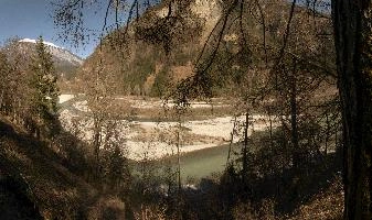 Stretch of the Grisonian Alpine Rhine river at Rhäzuns, showing shingle bed, water, bed, shingle, rhäzüns, grisonian, alpine, chur, gorge, valley, rhine, sunshine, grisons, spring, switzerland, mountains, europe, river