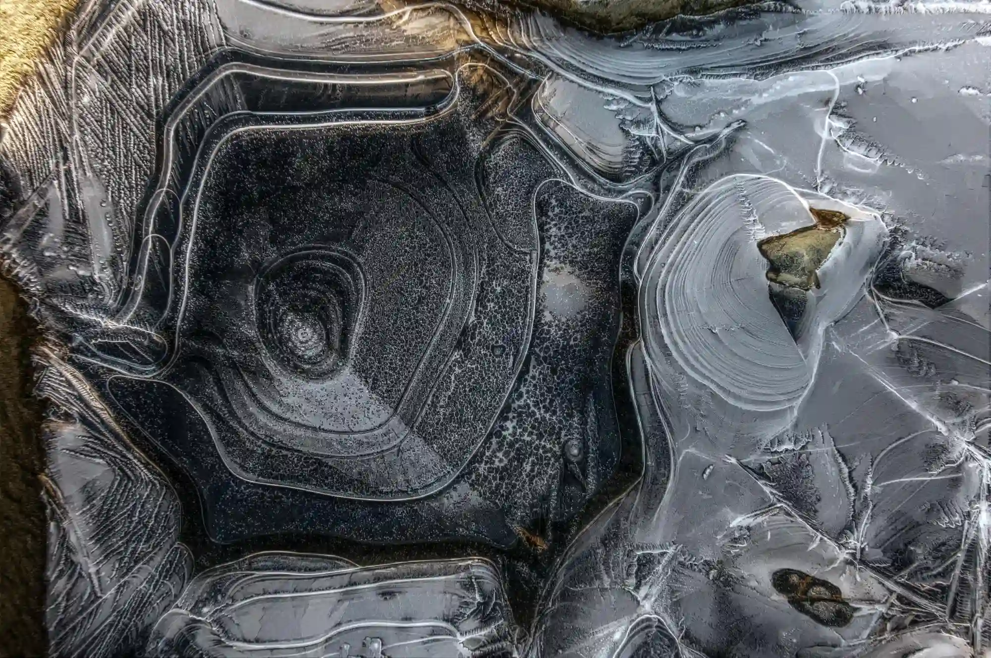 Patterns in river ice on the Rhine at Sargans, frozen, weather, winter, alpine, ice, icy, sargans, clear, river, thin, rhine, ridged, mountains, ripples, alps, stress, abstract, swiss, patterns, graphic, switzerland, cold, daylight