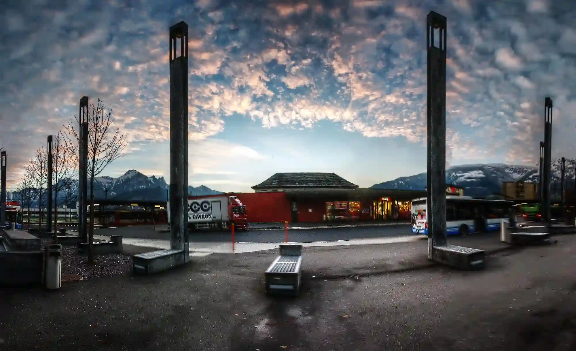 Evening sky behind the lights of the new bus station in Sargans, Swiss Alps, null