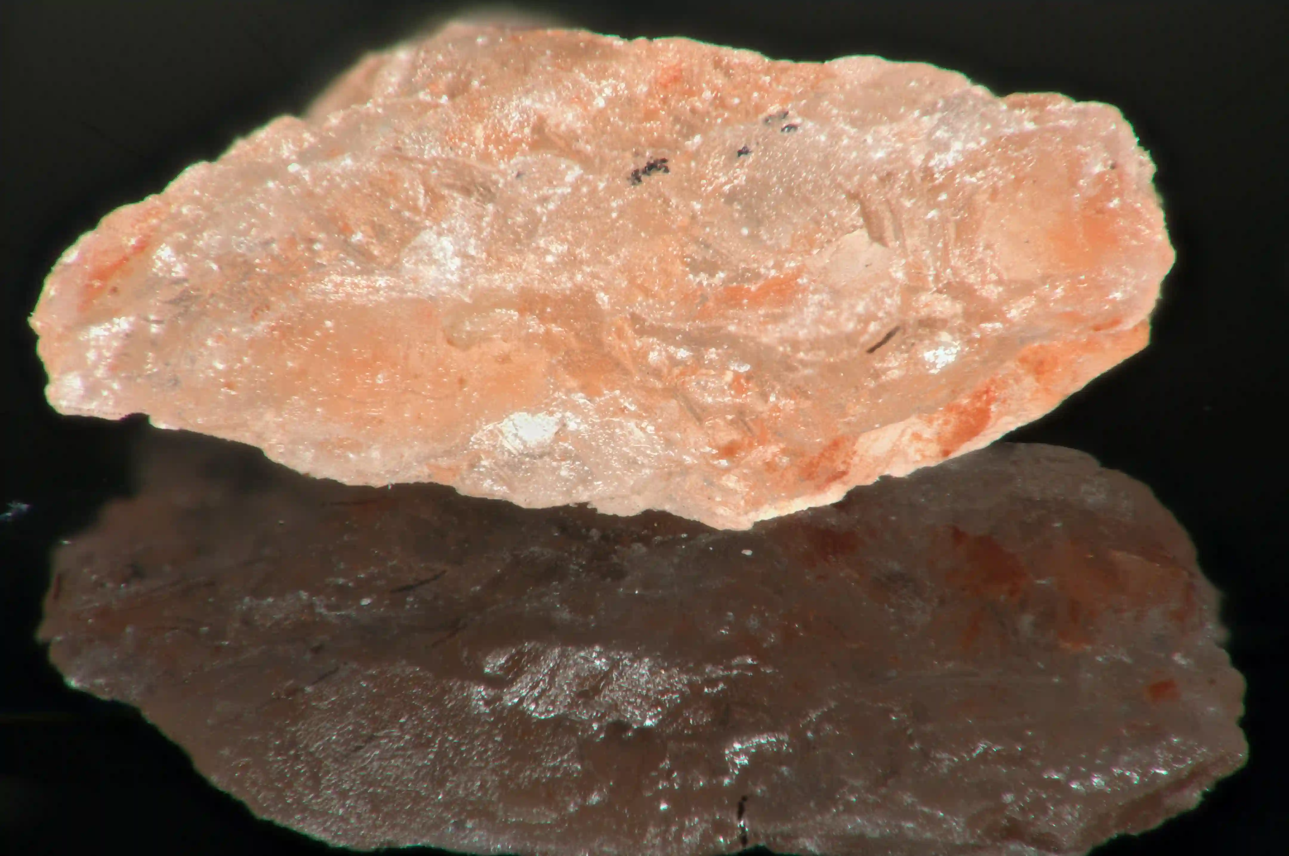 Crystal of Himalayan pink salt on glass table, salt, himalaya, rock, pink, crystal, hard, jagged, reflection