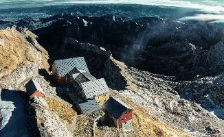 View from Säntis in Appenzell at daybreak, showing the old station buildings just below the peak., range, station, peaks, old, säntis, weather, mountains, daybreak, shelter, alpine, earl, ski-lift, swiss, morning, slate, appenzell, view, grey, saentis, scenery, roof, alps, stone, rooves, switzerland, rock, buildings