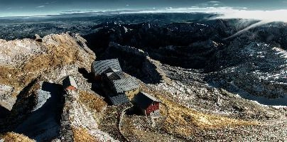 View from Säntis in Appenzell at daybreak, showing the old station buildings just below the peak., range, station, peaks, old, säntis, weather, mountains, daybreak, shelter, alpine, earl, ski-lift, swiss, morning, slate, appenzell, view, grey, saentis, scenery, roof, alps, stone, rooves, switzerland, rock, buildings