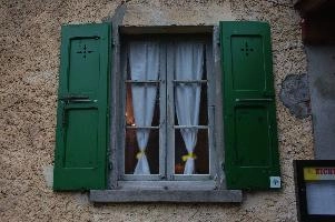 Shuttered cafe window in Cabbio, Ticino, ticino