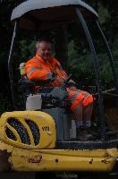 Digger driver in Cabbio, Ticino, ticino, switzerland, cabbio, driver, minicipal, warning, colouration, overalls, digger