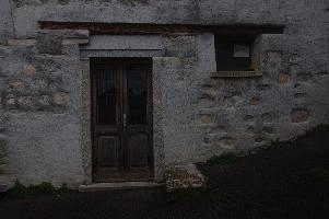 Entrance to rustico in Cabbio, Ticino, ticino, plastic, stone, nailed, warning, cairo, poisonous, crucified, fake, italy, black, model, montenotte, impaled, scorpion, toy, liguria, decoration, barn, dor, pierced, wall, dead, dego, italian, exterior, outdoors
