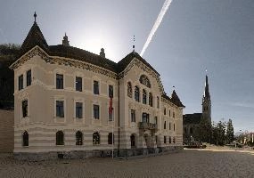 Government house and St. Florin Cathedral in Vaduz. Liechtenstein, facade, exterior, steeple, architecture, church, building, florin, urban, saint, town, cathedral, alps, peter-kaiser-platz, vaduz, parliament, liechtenstein, house, europe, government