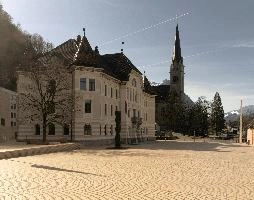 Government house and St. Florin Cathedral in Vaduz. Liechtenstein, facade, exterior, steeple, architecture, church, building, florin, urban, saint, town, cathedral, alps, peter-kaiser-platz, vaduz, parliament, liechtenstein, house, europe, government
