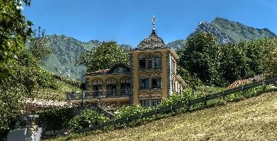 Asylantenheim am Walensee, mols, house, alpine, mountains, roof, swiss, walensee, tower, walenstadt, walls, switzerland, plastered, rich. grand, sunshine, exterior, ornate, alps, yellow, rendered, sky, blue