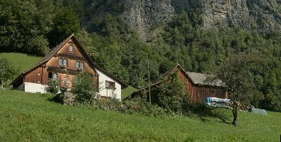 Farmhouse and bran in Flums, Switzerland, chalet, alps, valley, clouds, walenstadtberg, walenstadt, switzerland